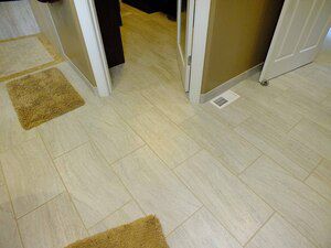 Porcelain tile in the master bath suite became warm and inviting with electric radiant floor heating
