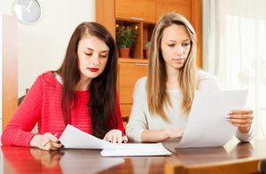 Two women reviewing paperwork