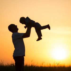 Father lifting child in the air