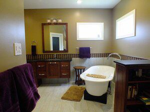 Radiant floor heating warms the cold tile in a newly remodeled master bathroom suite