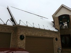 WarmlyYours donated a roof and gutter de-icing system to Tee Shirts 4 Troops.