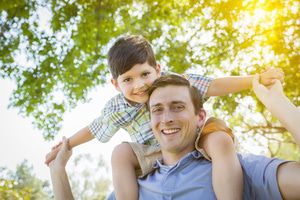 Father with son on shoulders