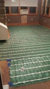 Installing TempZone Radiant floor heating from WarmlyYours as part of a dining room remodeling project
