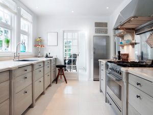 Keep walkways open to enable easy movement in the kitchen. Add floor heating to keep the tile warm.