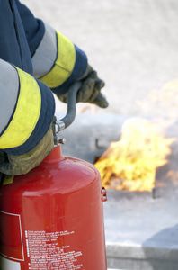 Firefighter putting out a fire started by a space heater