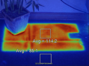 Thermal image depicting trapped heat under mat placed on the floor for 30 minutes.