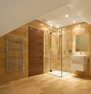 Wrap yourself in luxury with a fluffy bath towel heated on a towel warmer.